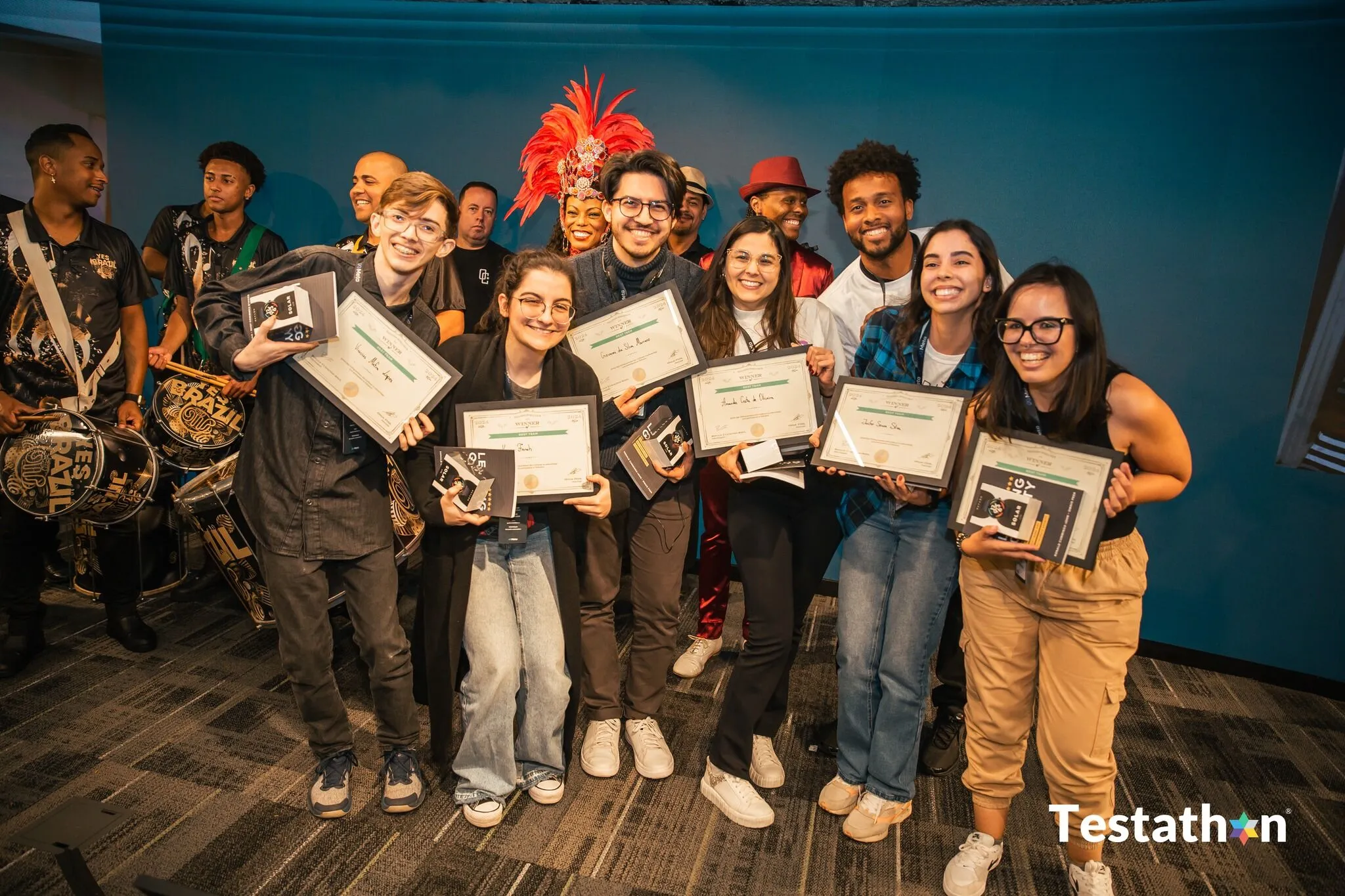 Award moment at Testathon World Tour São Paulo 2024: people holding "Winner — Best Team" certificates